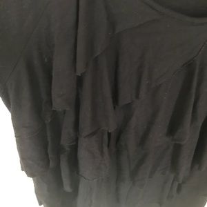 Black 3/4 sleeve with ruffles on front.